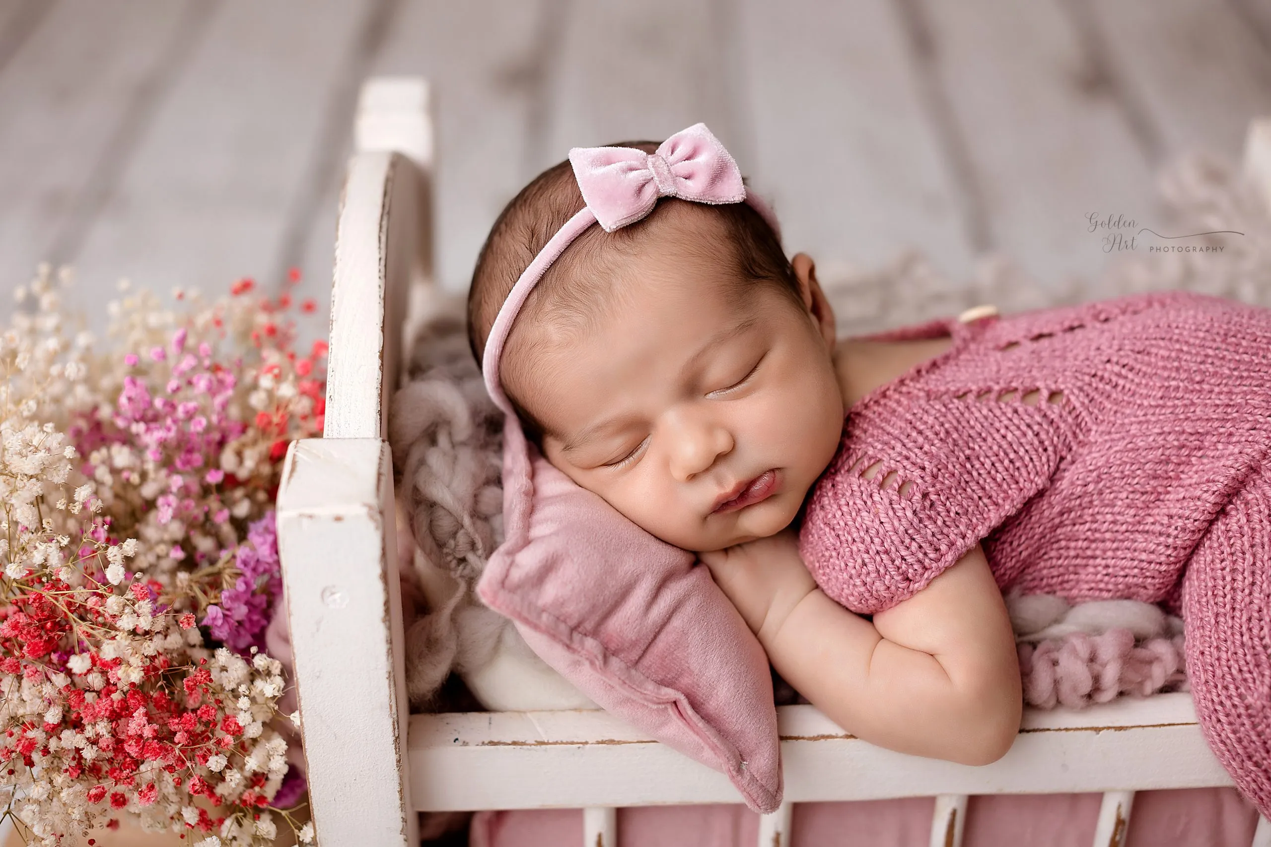 Newborn baby posed for a studio newborn photography session in Plano, Texas